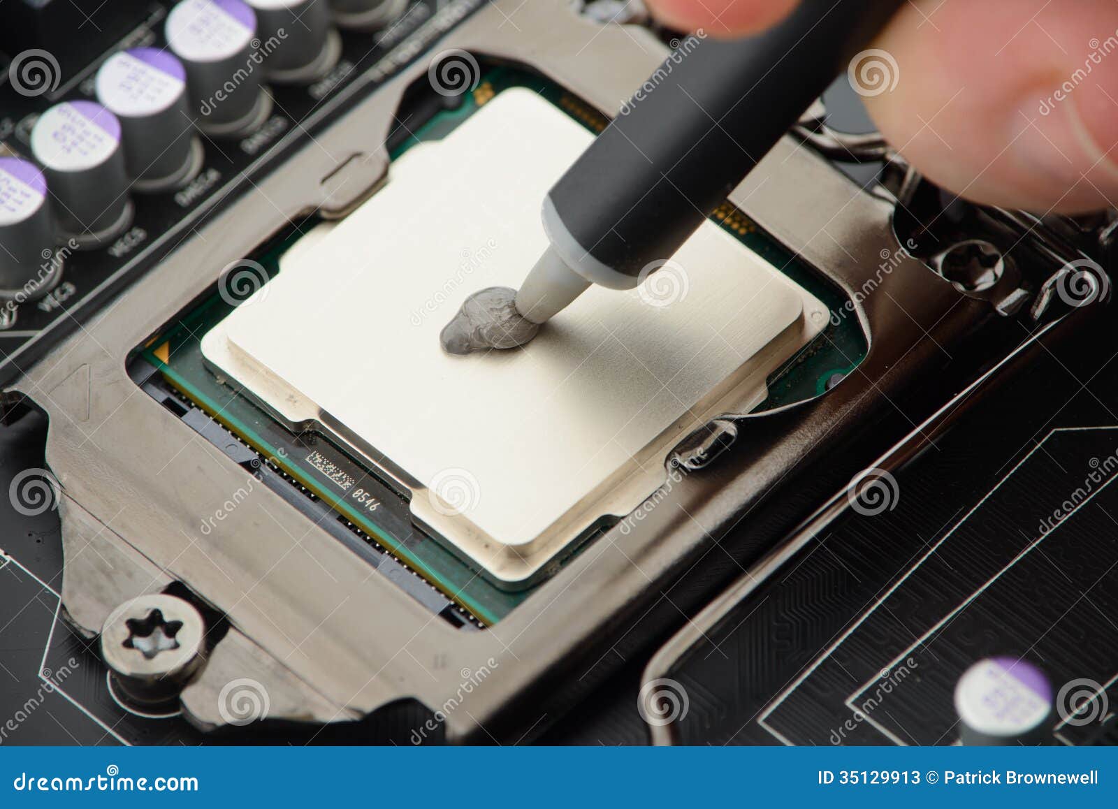 applying-thermal-paste-to-cpu-processor-motherboard-35129913.jpg