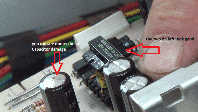 blown-washing-machine-cuircuit-board-capacitor.png